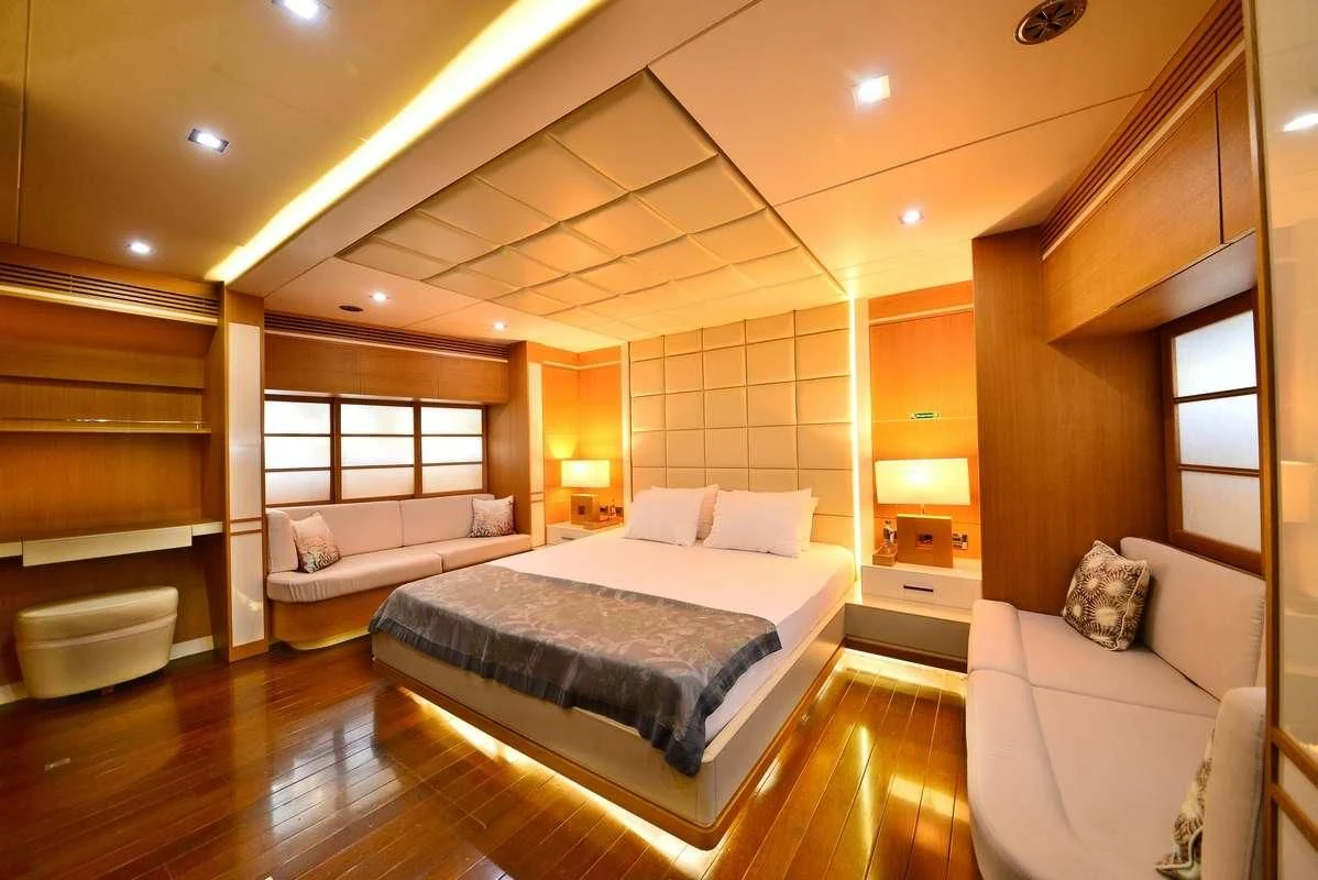 a large bedroom with a large bed aboard ZELDA Yacht for Sale