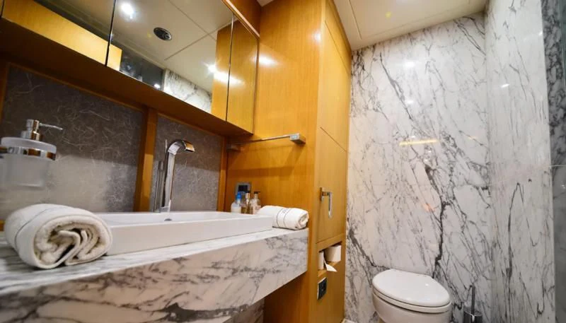 a bathroom with a bathtub and toilet aboard ZELDA Yacht for Sale