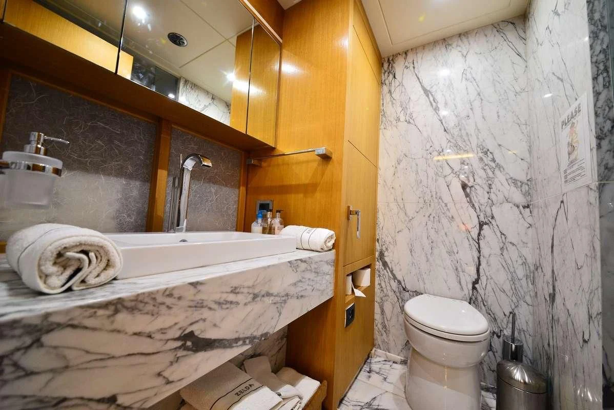 a bathroom with a sink toilet and bathtub aboard ZELDA Yacht for Sale