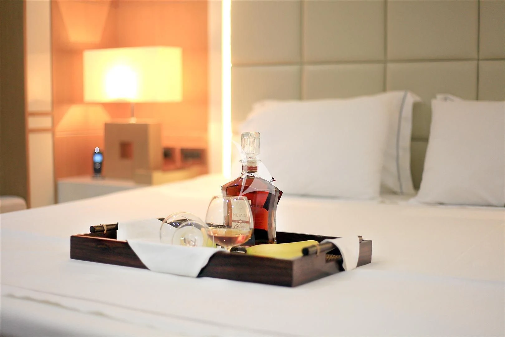 a bed with a tray of food and a tray of food aboard ZELDA Yacht for Sale