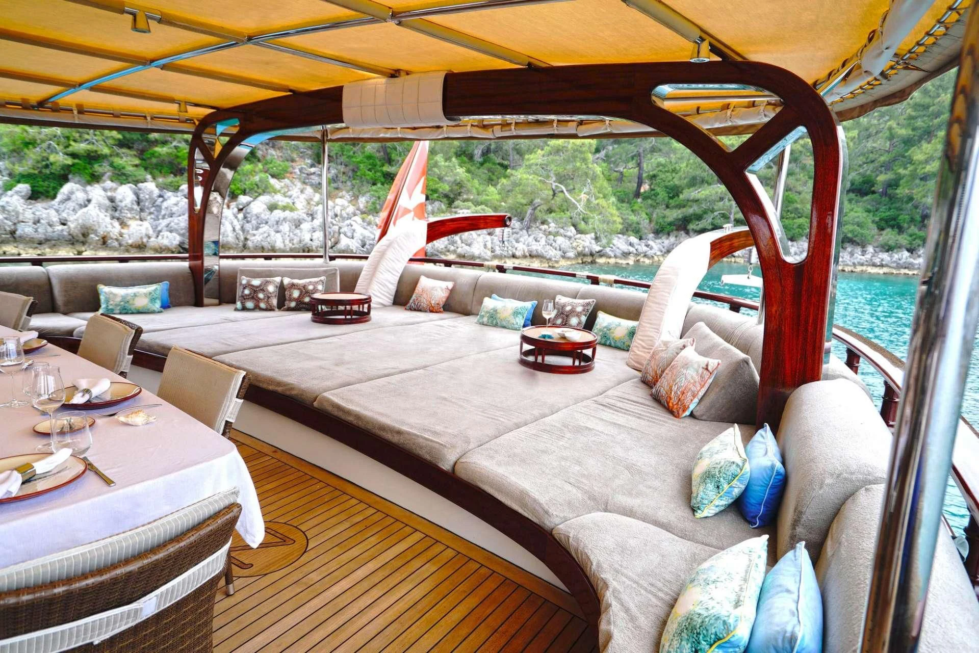 a bed with a couch and a table aboard ZELDA Yacht for Sale