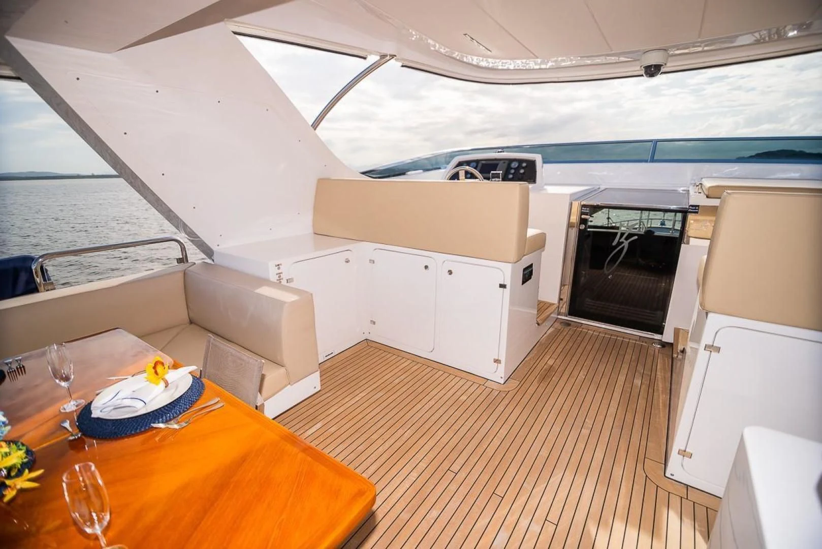 a boat with a table and chairs aboard BLUE BAY Yacht for Sale