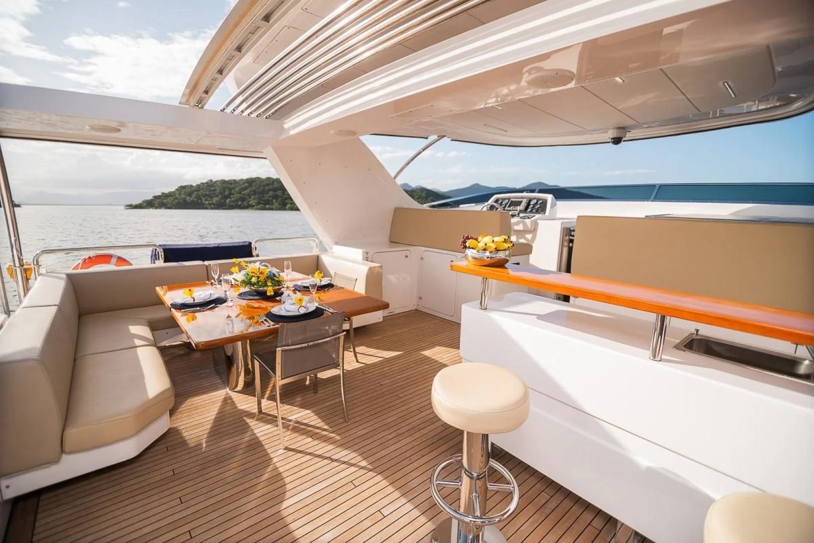 a room with a table and chairs aboard BLUE BAY Yacht for Sale