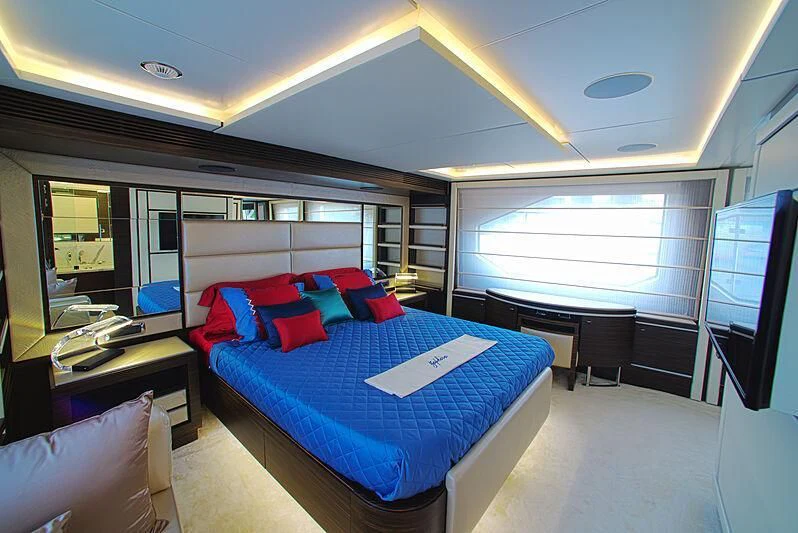 a room with a bed and a desk aboard BLUE BAY Yacht for Sale