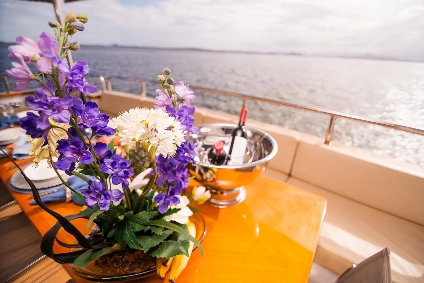 a vase of flowers on a table aboard BLUE BAY Yacht for Sale
