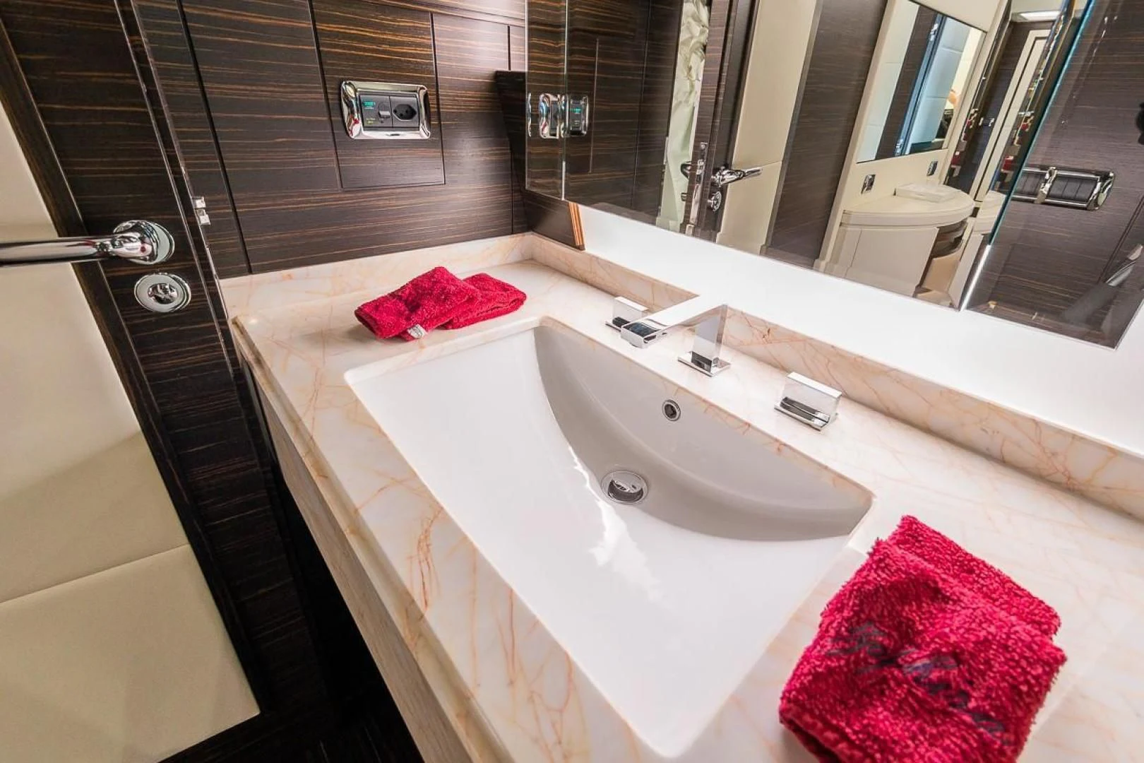 a bathroom with a sink and a mirror aboard BLUE BAY Yacht for Sale