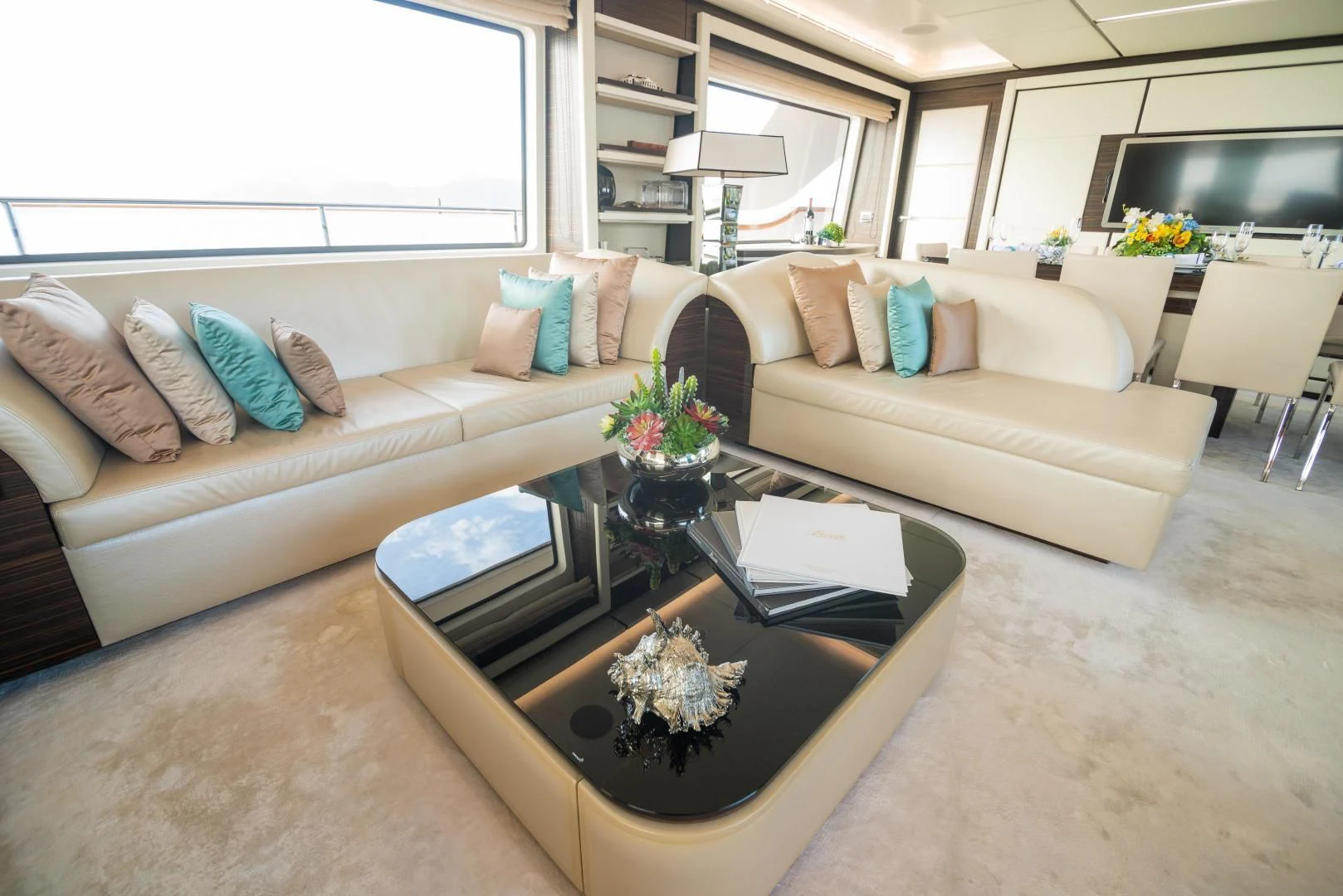 a living room with a couch and coffee table aboard BLUE BAY Yacht for Sale