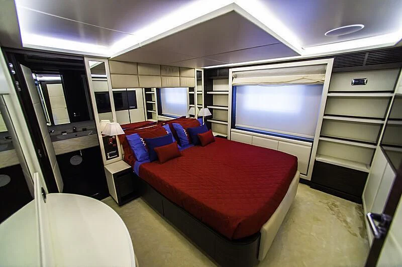 a room with a bed and a window aboard BLUE BAY Yacht for Sale
