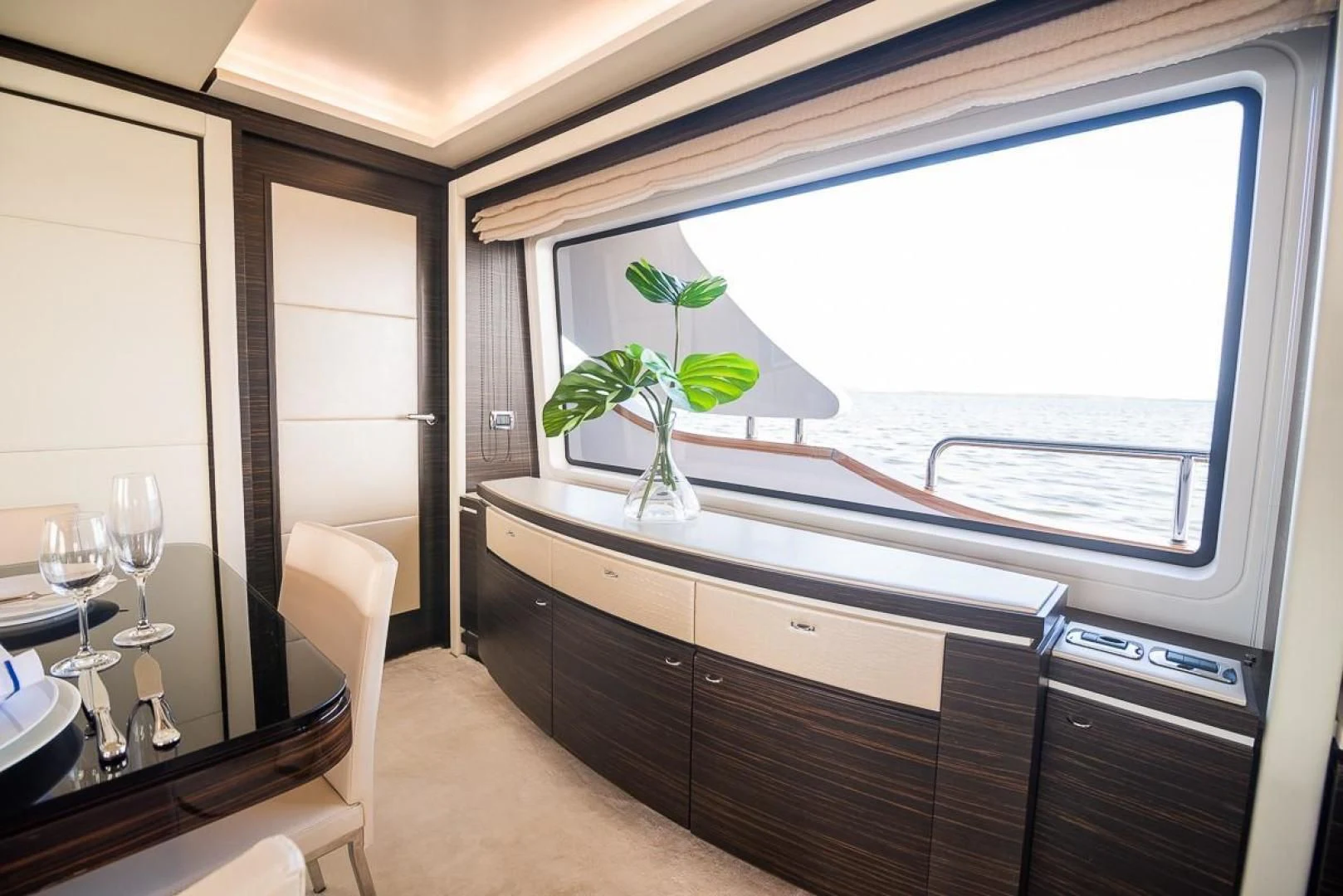 a room with a plant and a window aboard BLUE BAY Yacht for Sale