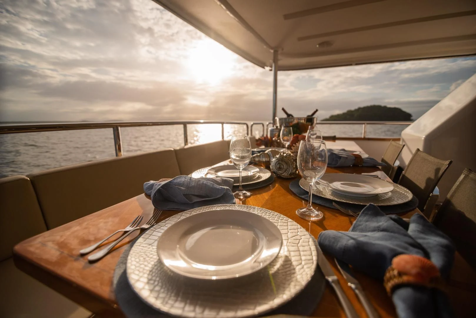 a table with plates and glasses aboard BLUE BAY Yacht for Sale
