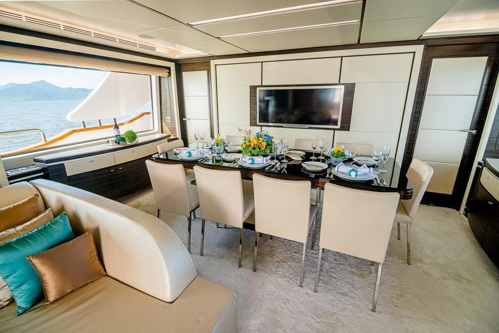 a room with a table and chairs aboard BLUE BAY Yacht for Sale