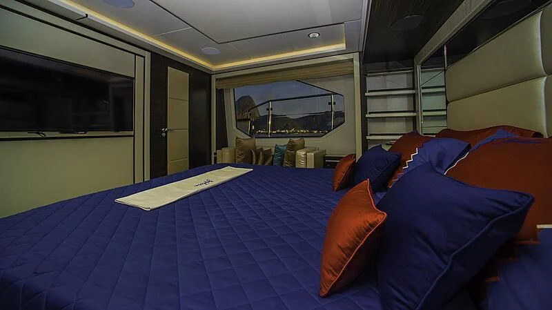 a person sleeping on a bed aboard BLUE BAY Yacht for Sale
