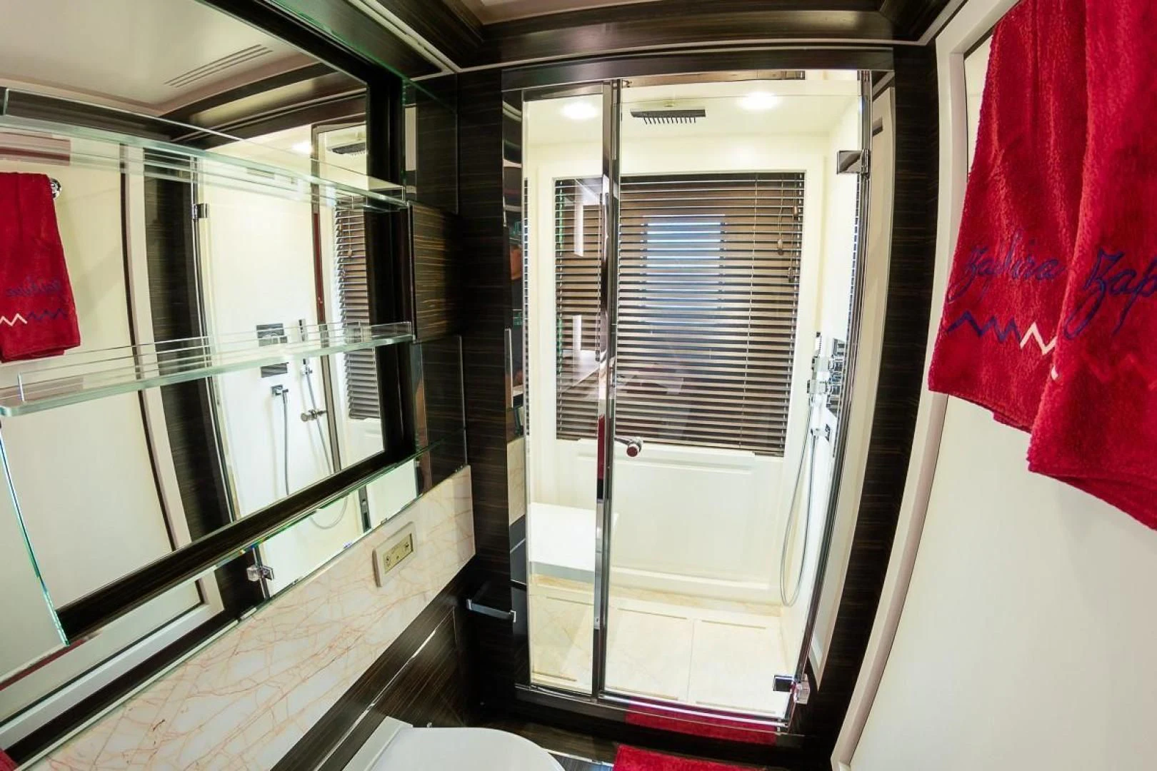 a hallway with glass doors aboard BLUE BAY Yacht for Sale