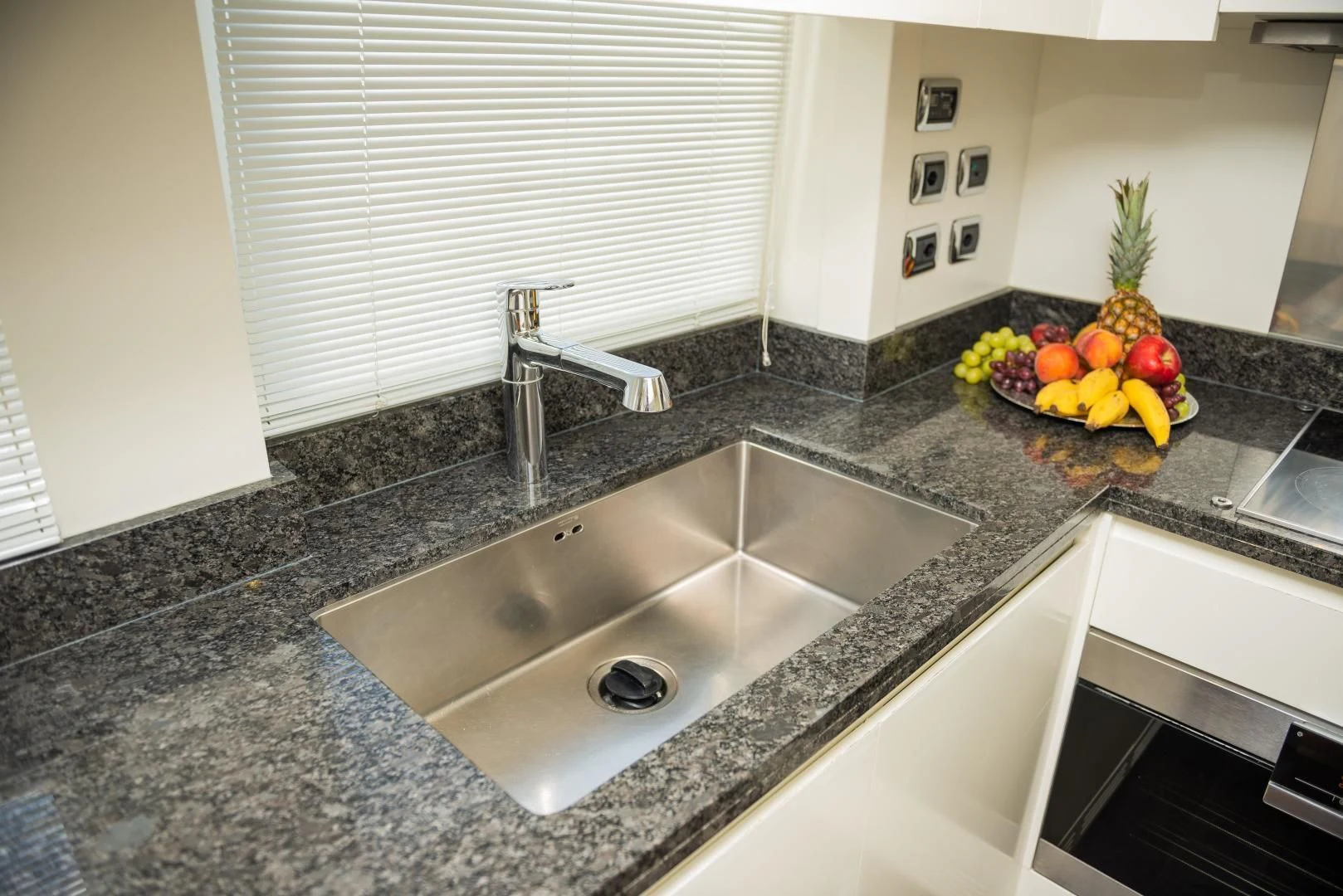 a kitchen with a marble counter top aboard BLUE BAY Yacht for Sale