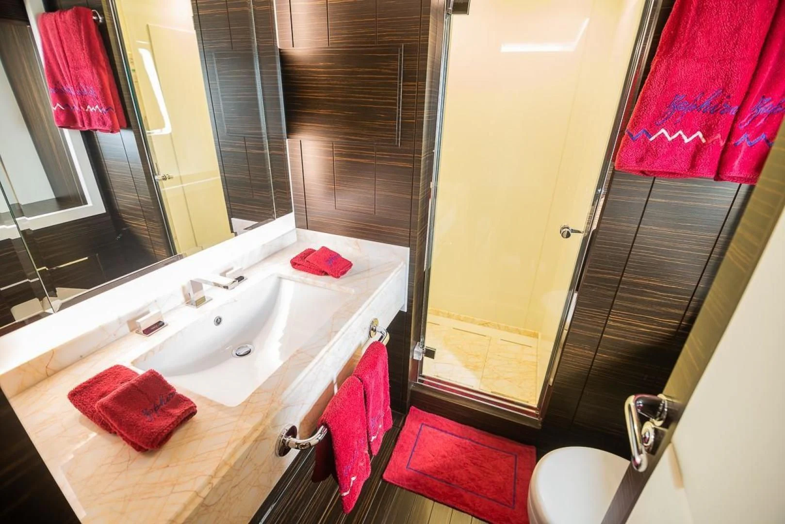 a bathroom with a sink and a mirror aboard BLUE BAY Yacht for Sale