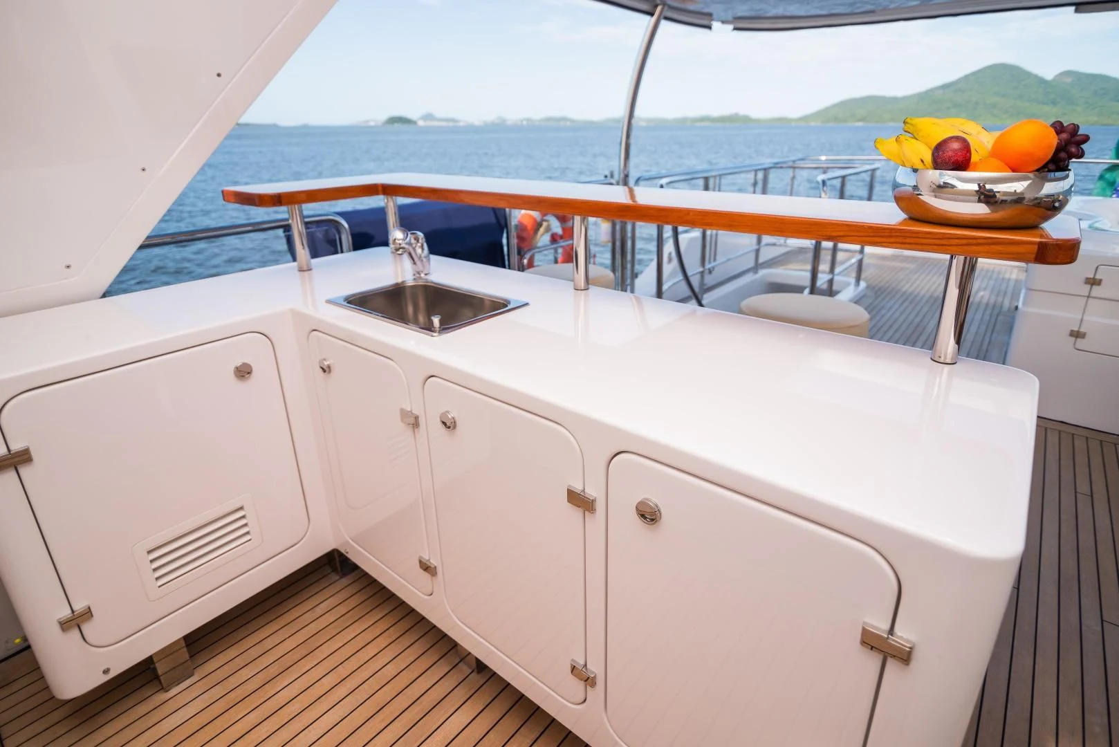 a boat with white cabinets and a sink on a deck aboard BLUE BAY Yacht for Sale