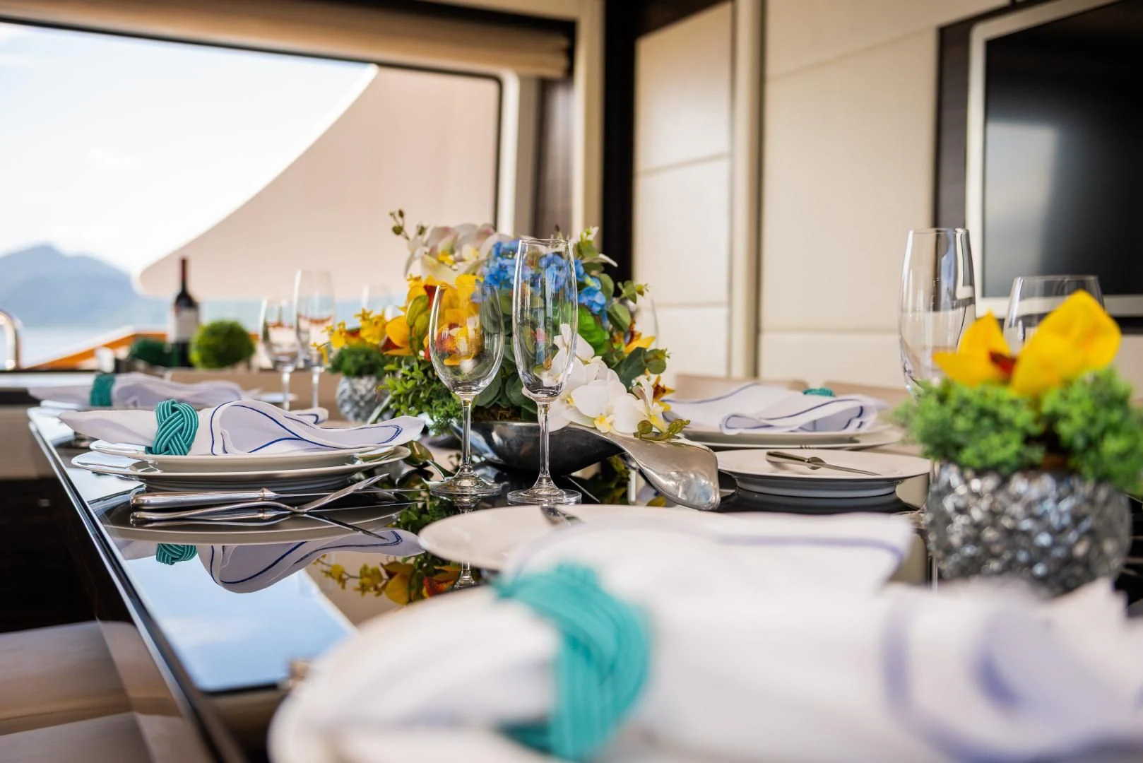 a table set with place settings aboard BLUE BAY Yacht for Sale