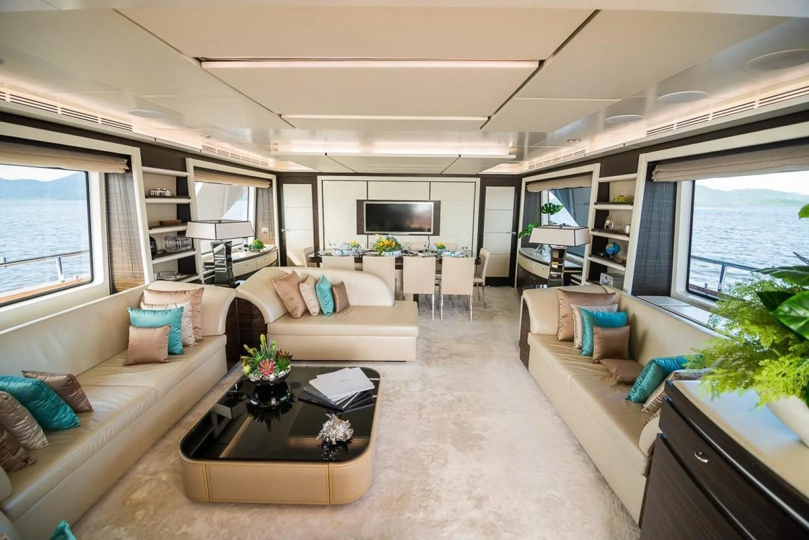 a living room with a couch and a coffee table aboard BLUE BAY Yacht for Sale
