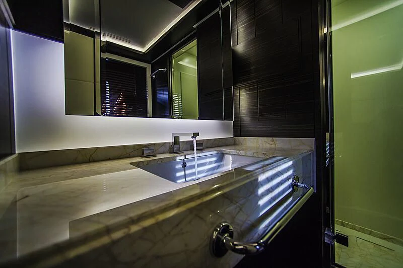 a bathroom with a sink and a mirror aboard BLUE BAY Yacht for Sale