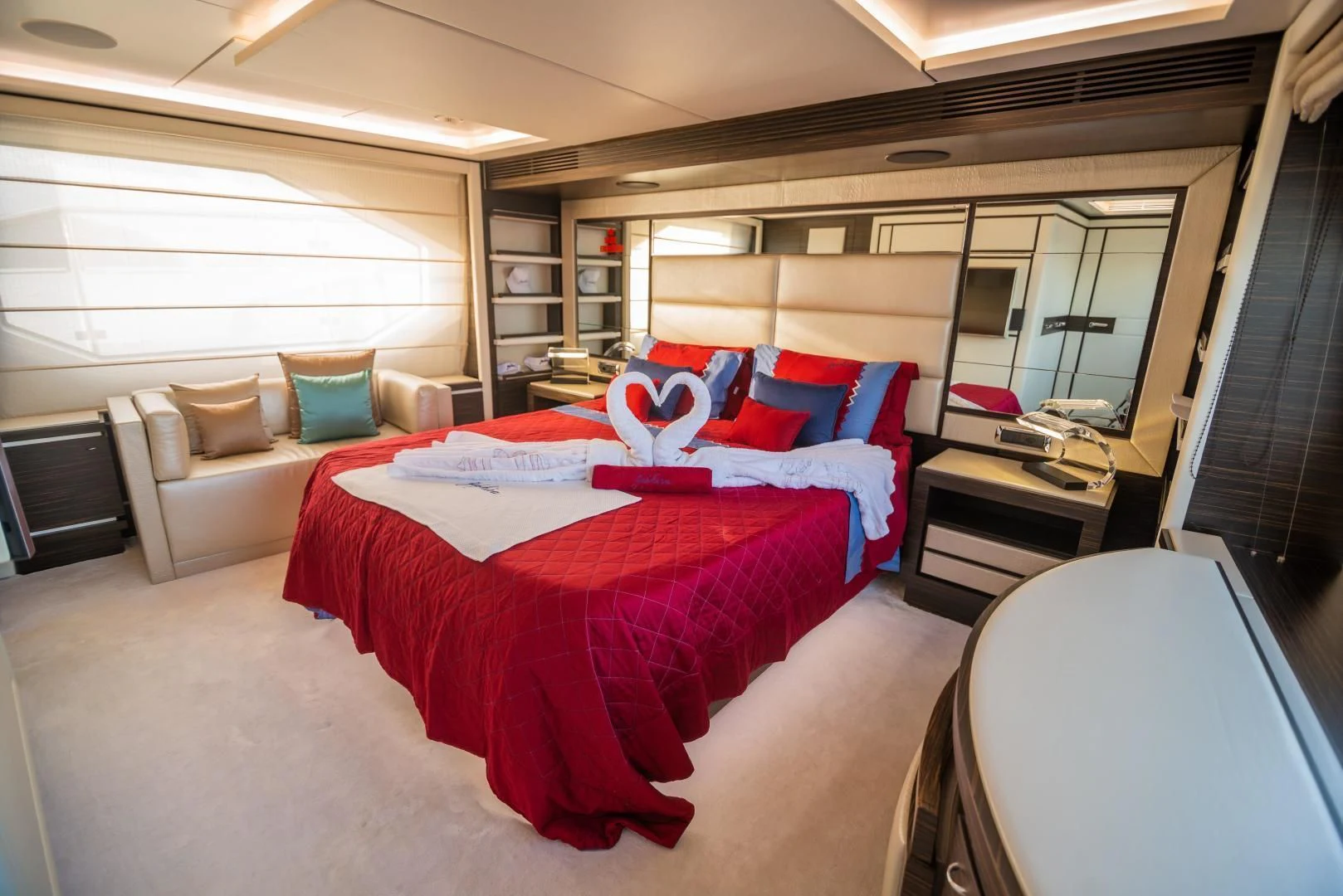 a room with a bed and a couch aboard BLUE BAY Yacht for Sale