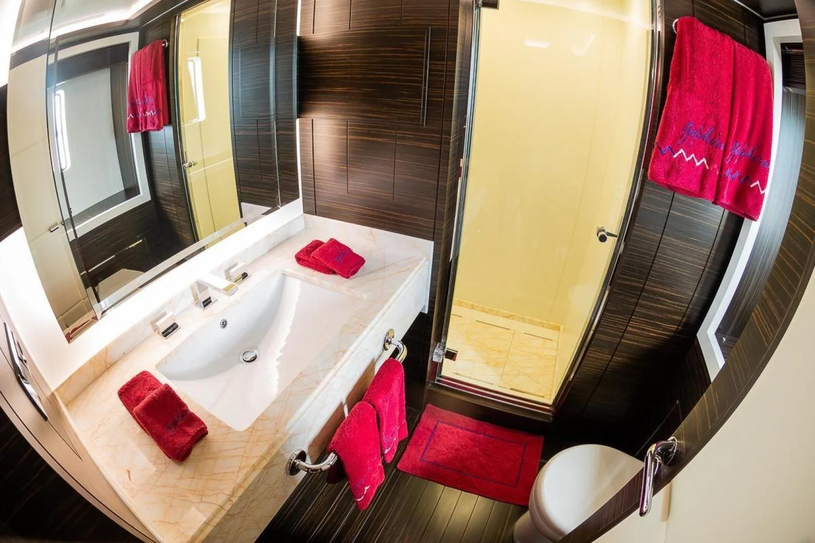 a bathroom with a sink and mirror aboard BLUE BAY Yacht for Sale