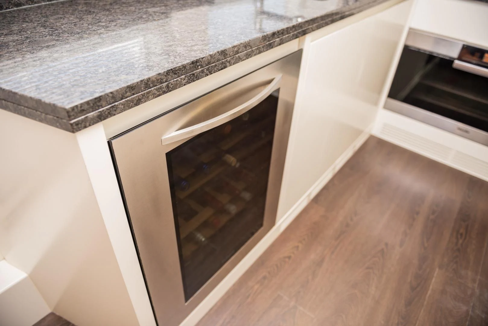 a white cabinet with a black door aboard BLUE BAY Yacht for Sale