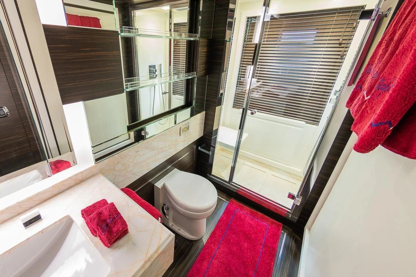 a bathroom with a toilet and a sink aboard BLUE BAY Yacht for Sale