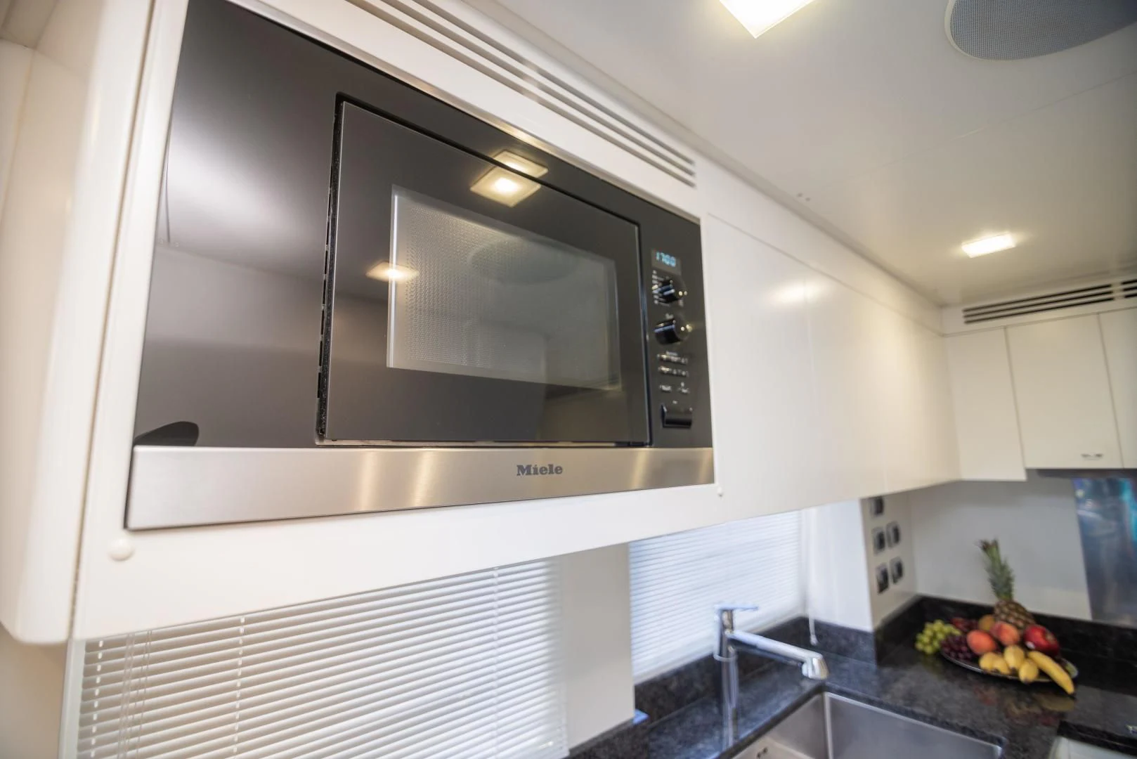 a kitchen with a microwave oven aboard BLUE BAY Yacht for Sale