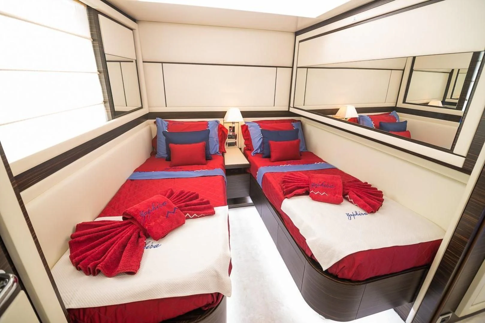 a room with beds and a couch aboard BLUE BAY Yacht for Sale