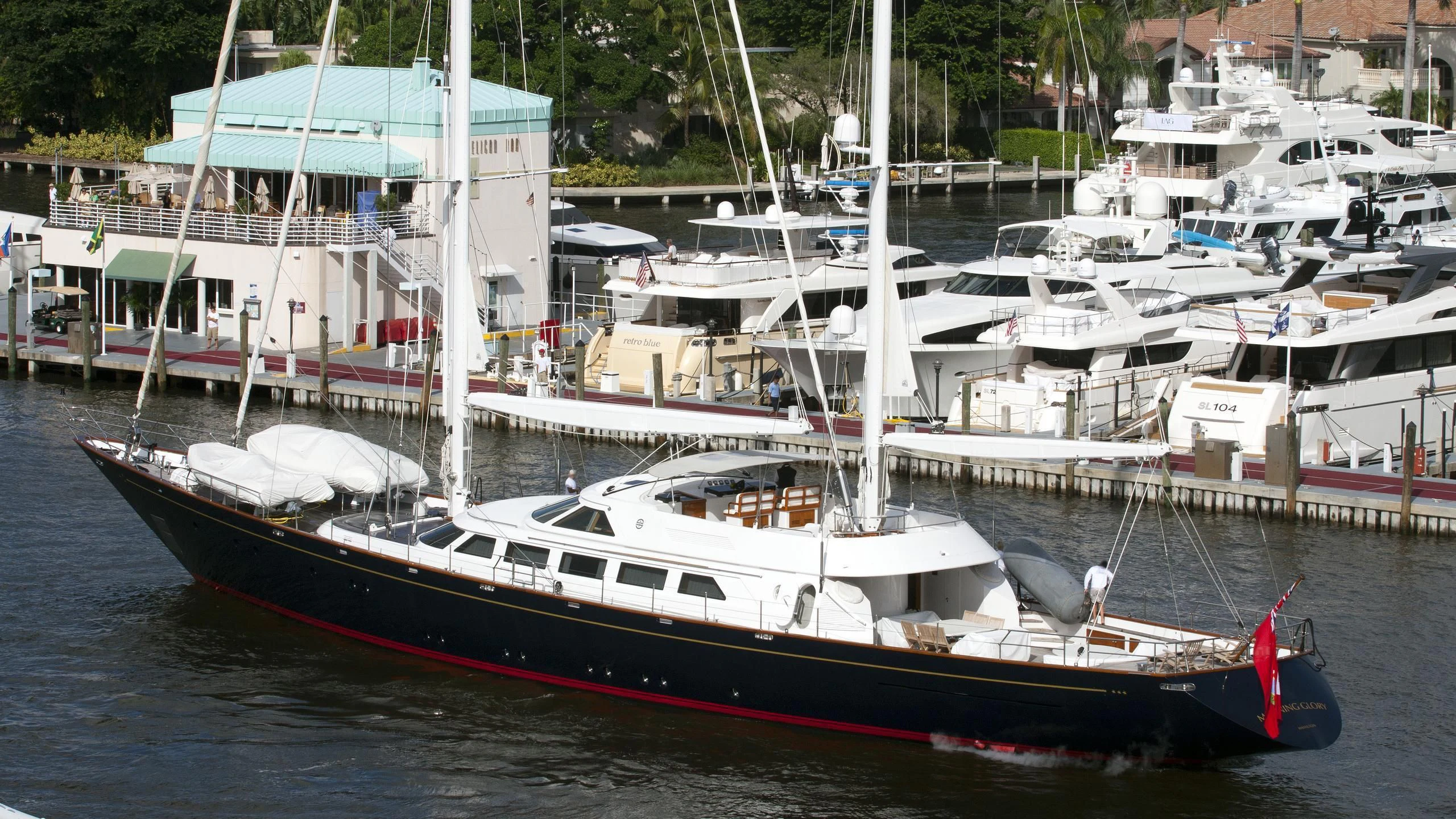 a boat docked at a pier aboard MORNING GLORY Yacht for Sale