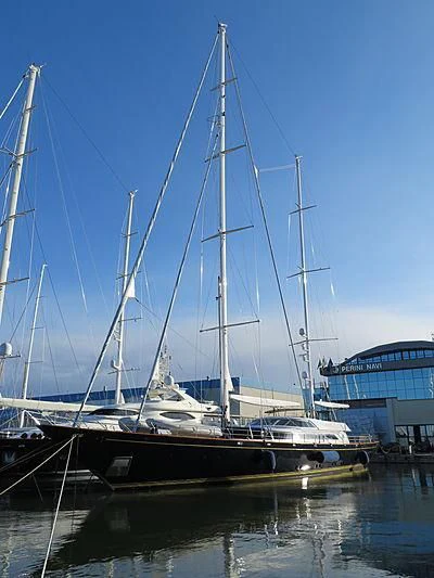 a sailboat docked at a pier aboard MORNING GLORY Yacht for Sale