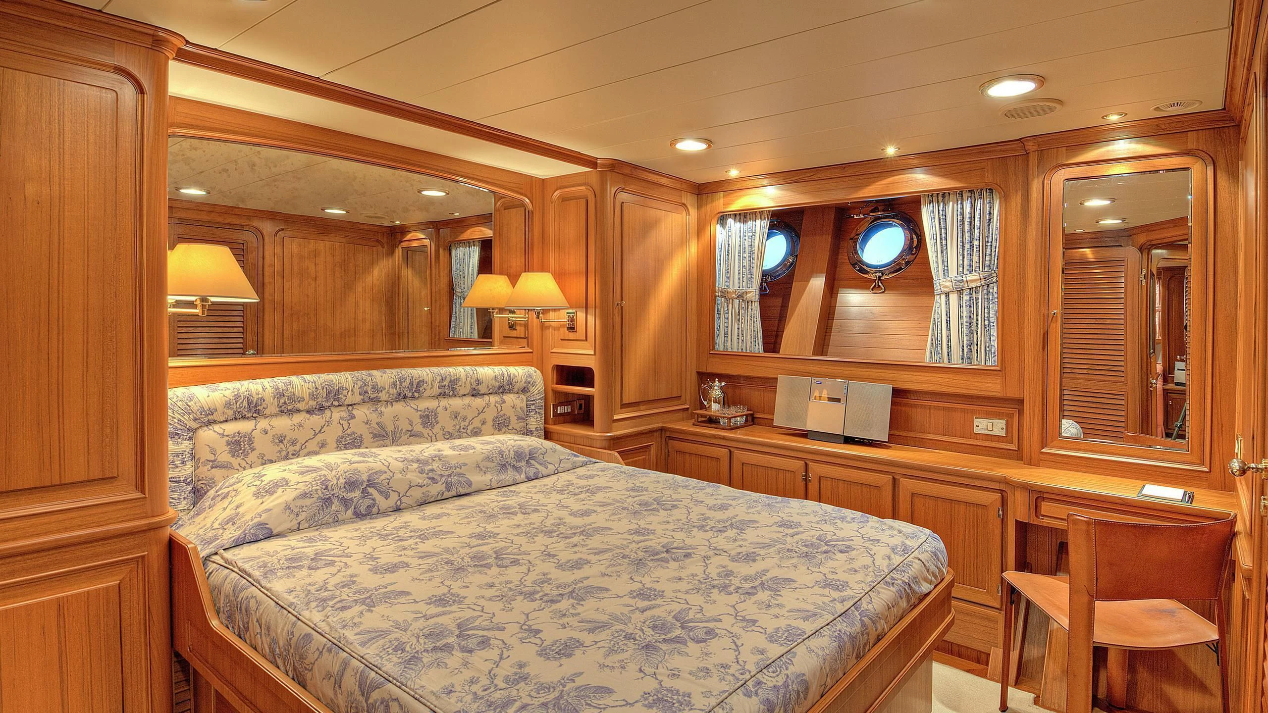 a bedroom with a large bed aboard MORNING GLORY Yacht for Sale