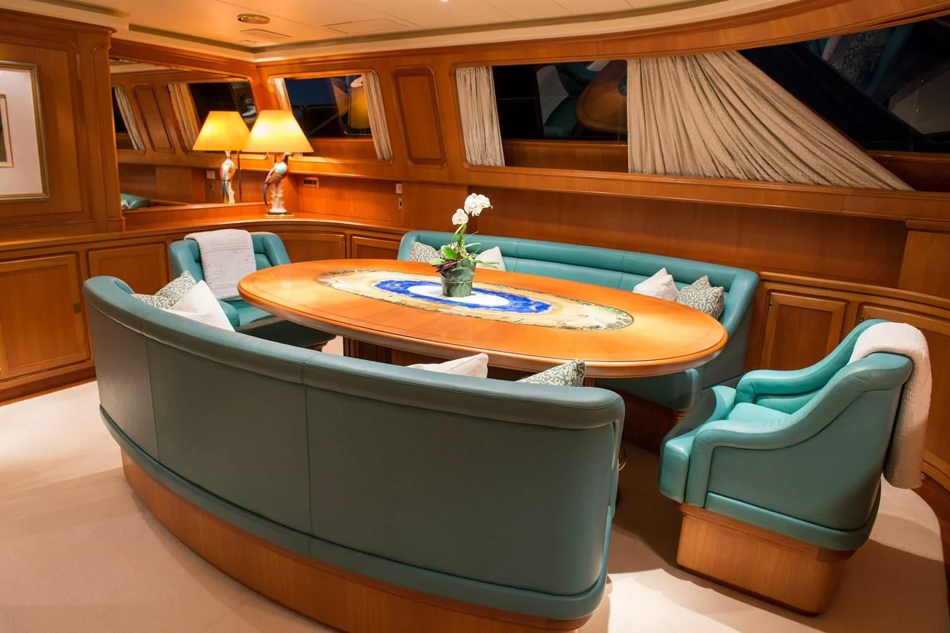 a living room with a couch and a table aboard MORNING GLORY Yacht for Sale