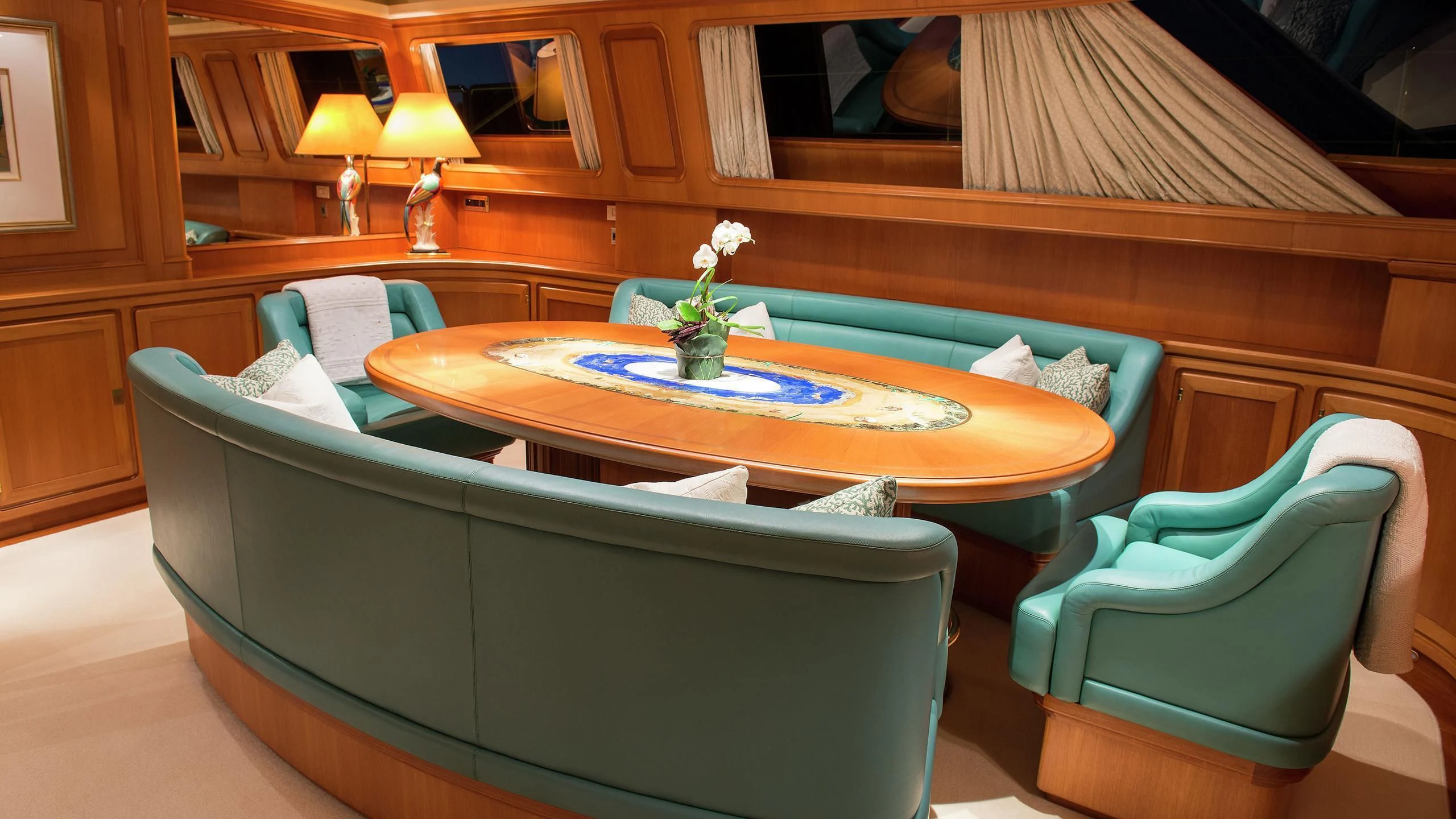 a living room with a couch and a table aboard MORNING GLORY Yacht for Sale