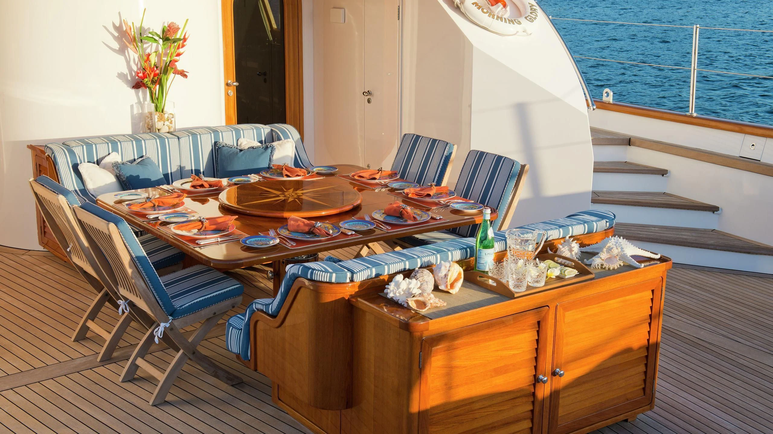 a dining table with food on it aboard MORNING GLORY Yacht for Sale