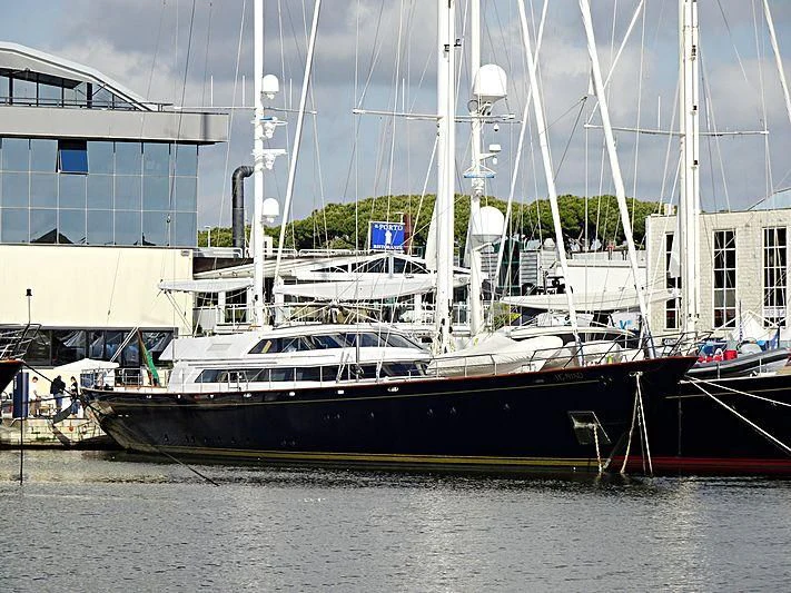 a boat docked in a harbor aboard MORNING GLORY Yacht for Sale