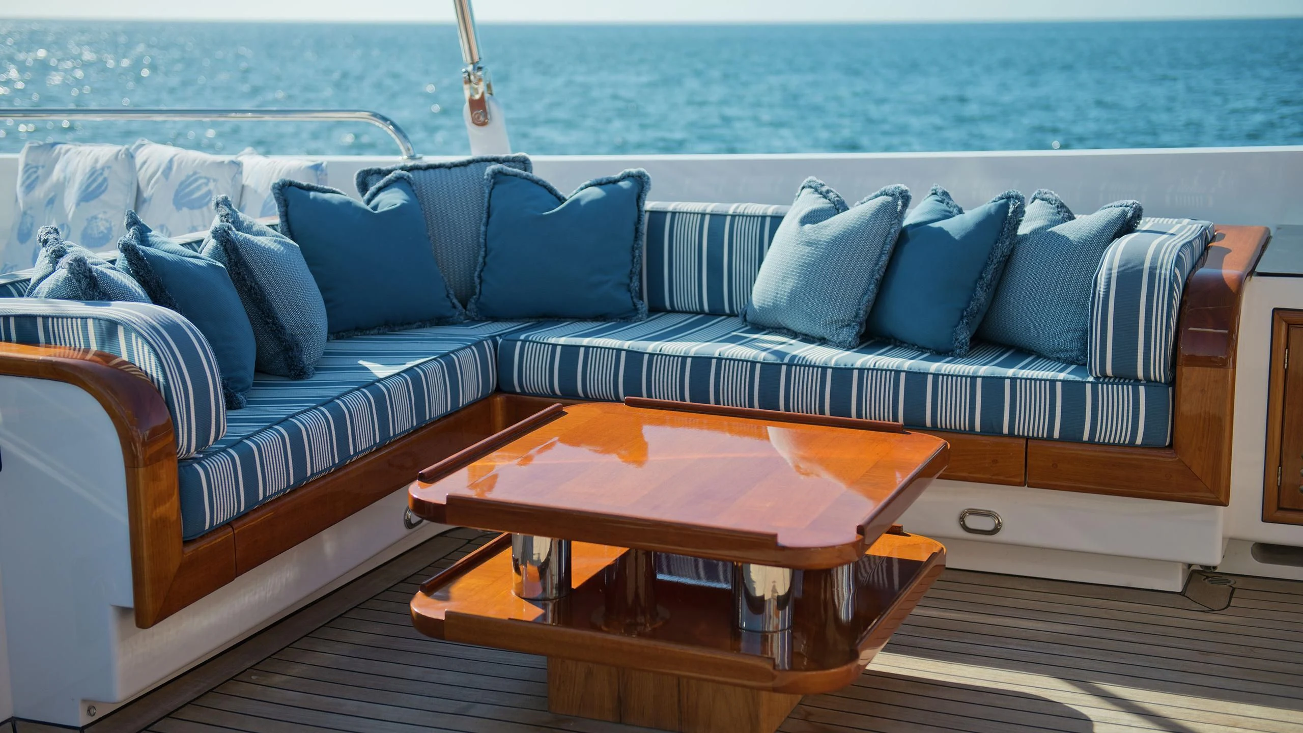 a couch with a coffee table on it aboard MORNING GLORY Yacht for Sale