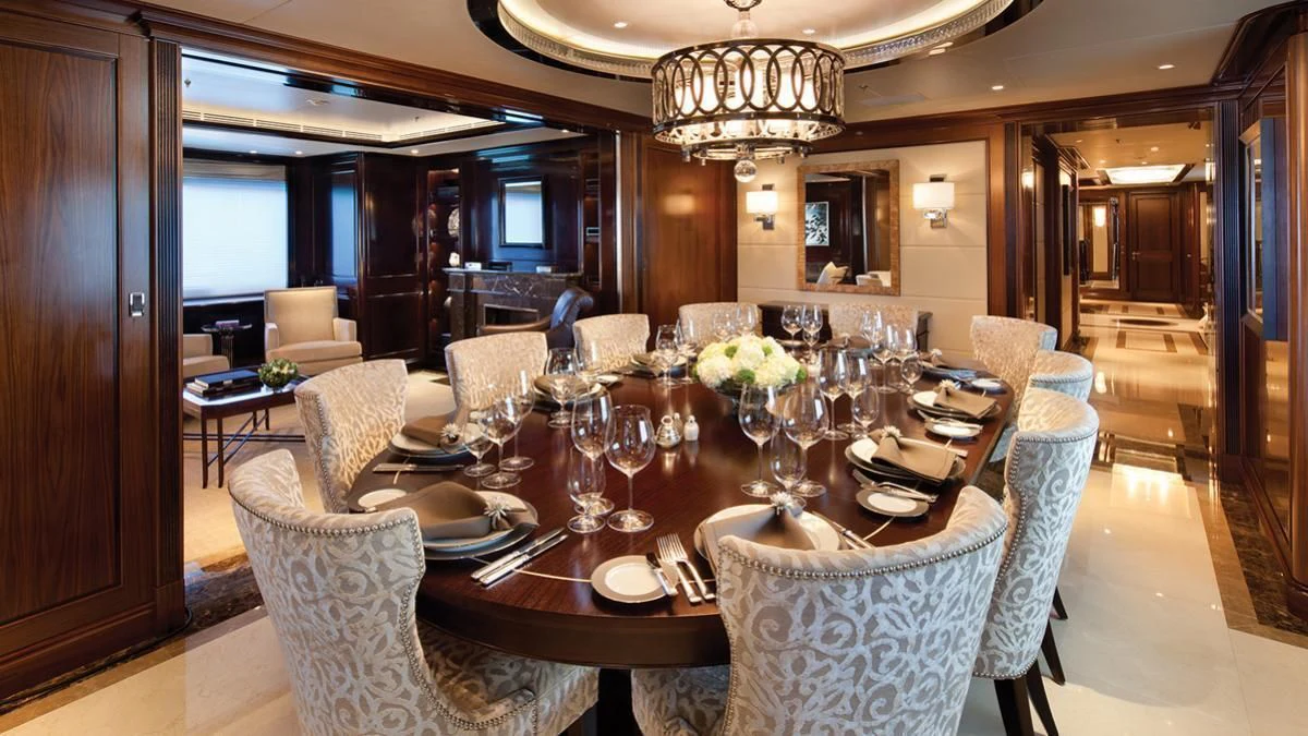 a dining room with a table set aboard SEANNA Yacht for Sale