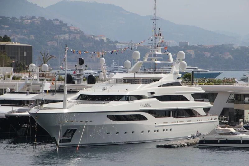 a white yacht in a harbor aboard SEANNA Yacht for Sale
