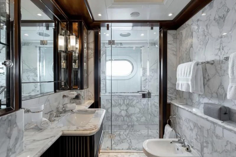 a bathroom with a glass shower aboard SEANNA Yacht for Sale