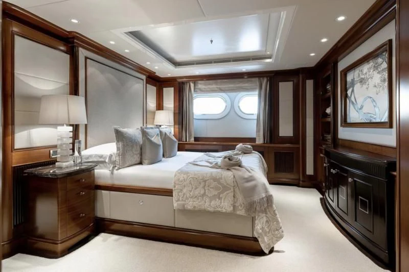 a large bedroom with a large mirror aboard SEANNA Yacht for Sale