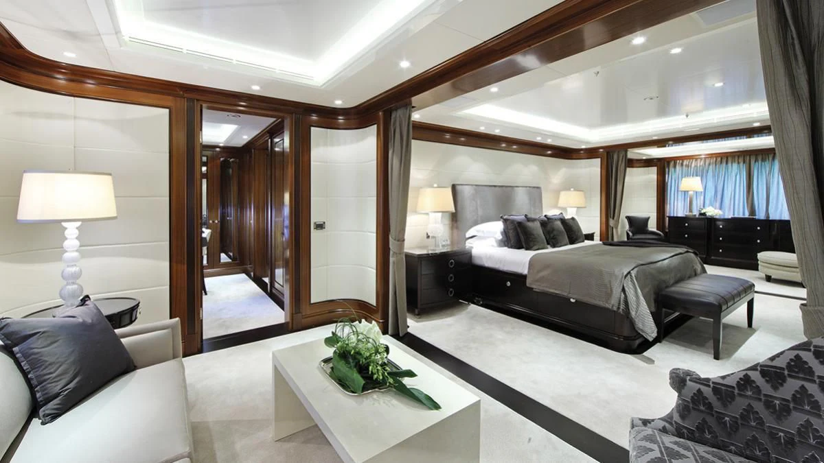 a large bedroom with a large mirror aboard SEANNA Yacht for Sale