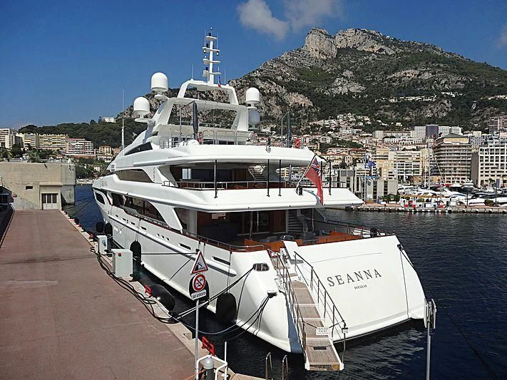 a large white boat on a dock aboard SEANNA Yacht for Sale