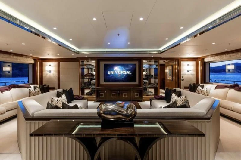 a living room with a large television aboard SEANNA Yacht for Sale