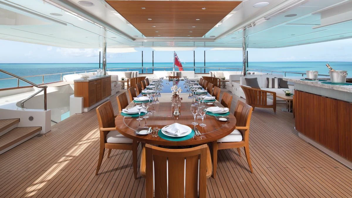 a large dining room with a wood floor and wood floors aboard SEANNA Yacht for Sale