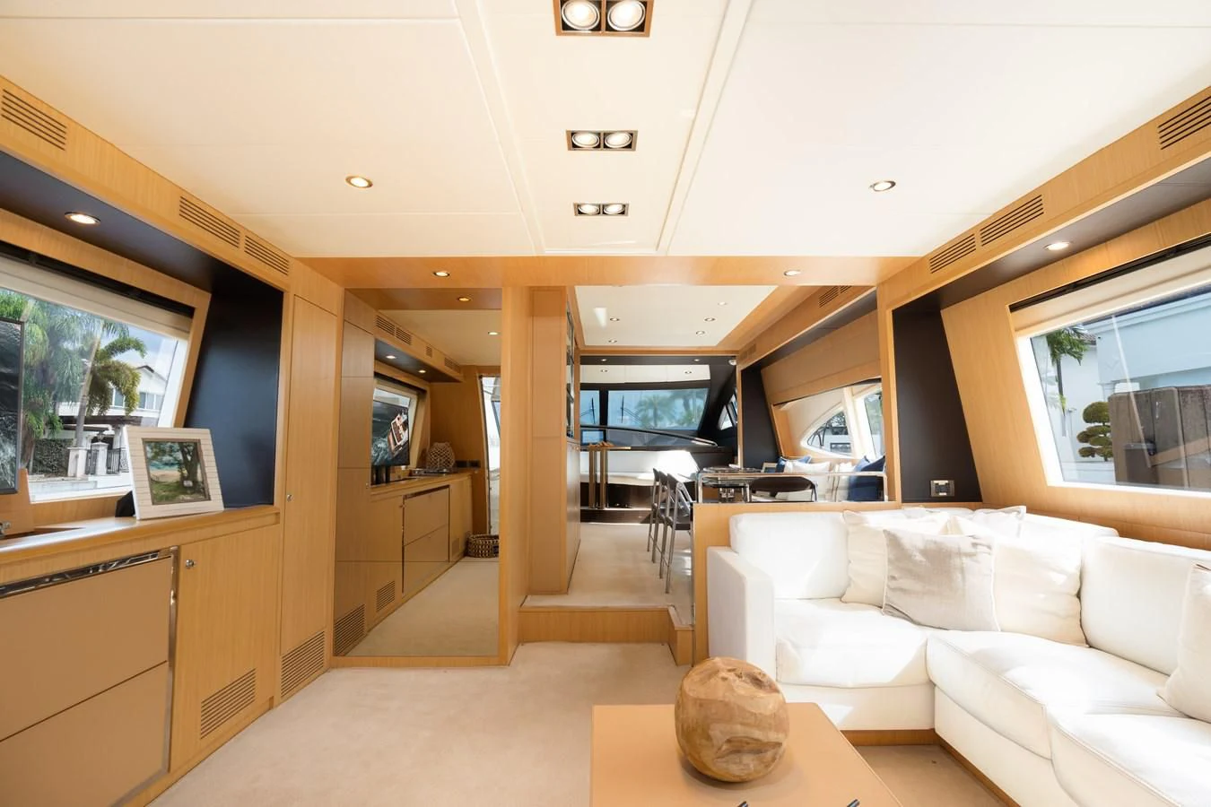 a living room with a white couch aboard 75' RIVA 2012 Yacht for Sale