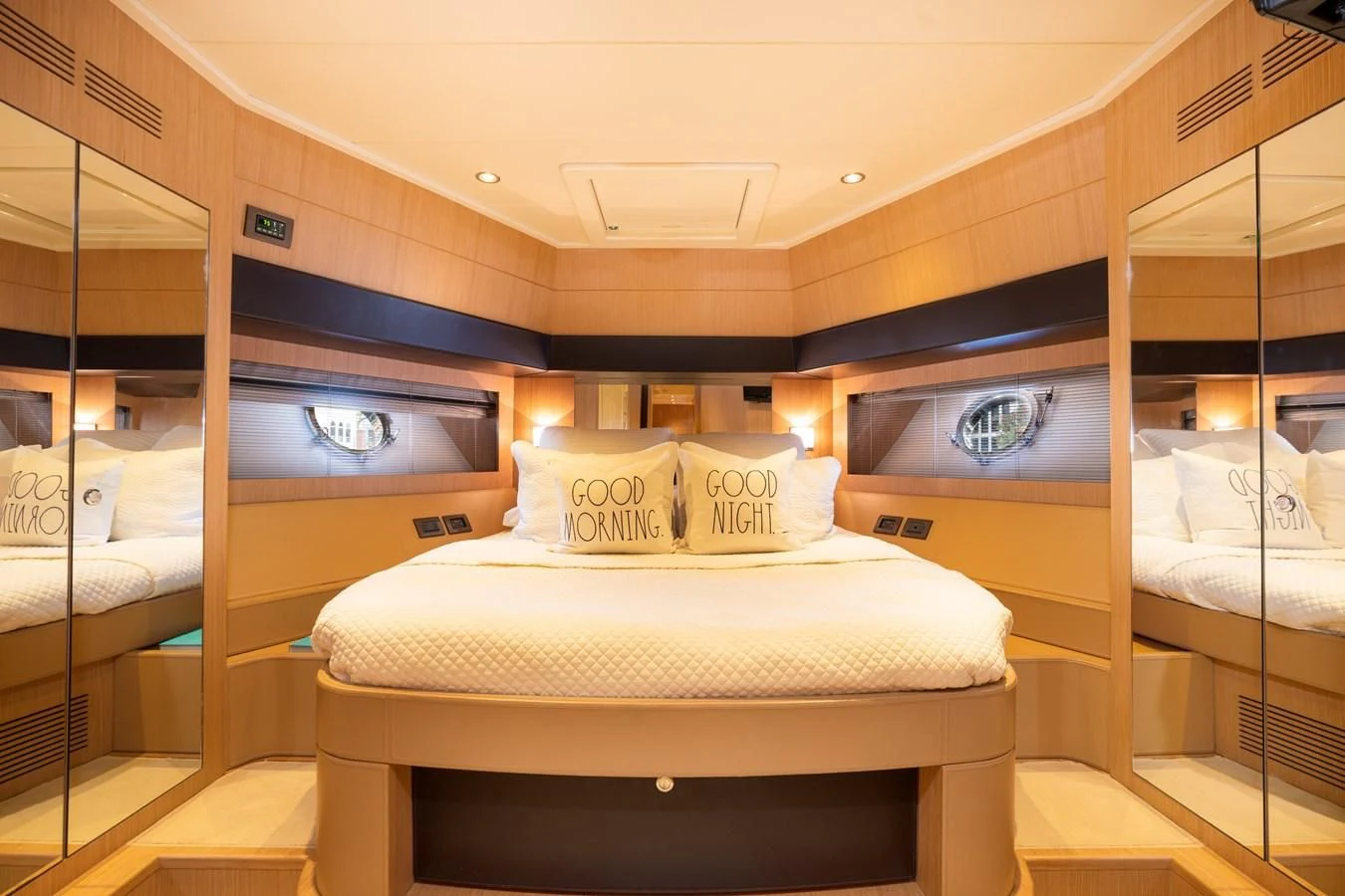 a room with a bed and a mirror aboard 75' RIVA 2012 Yacht for Sale