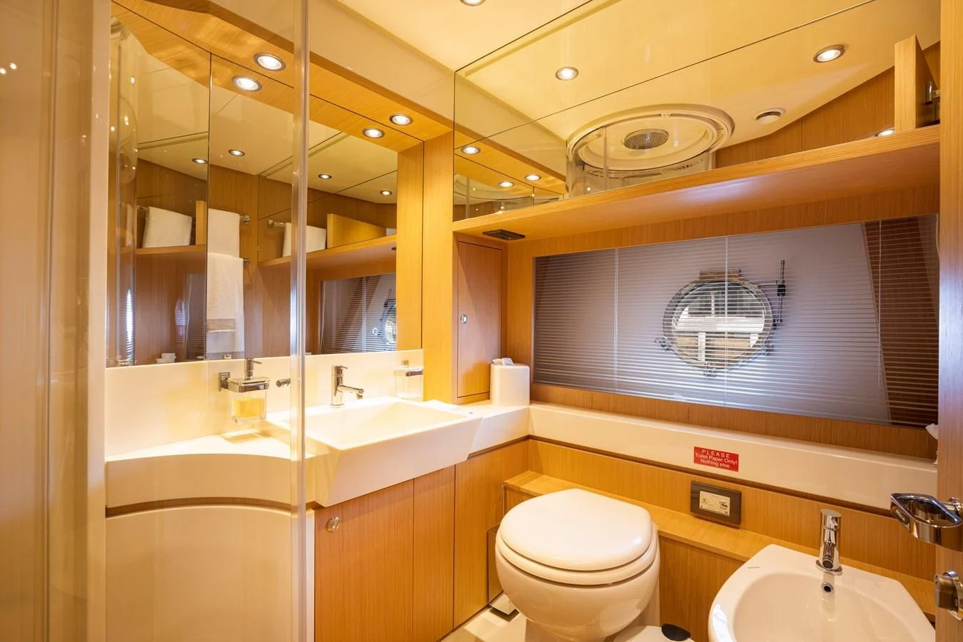 a bathroom with a large mirror aboard 75' RIVA 2012 Yacht for Sale