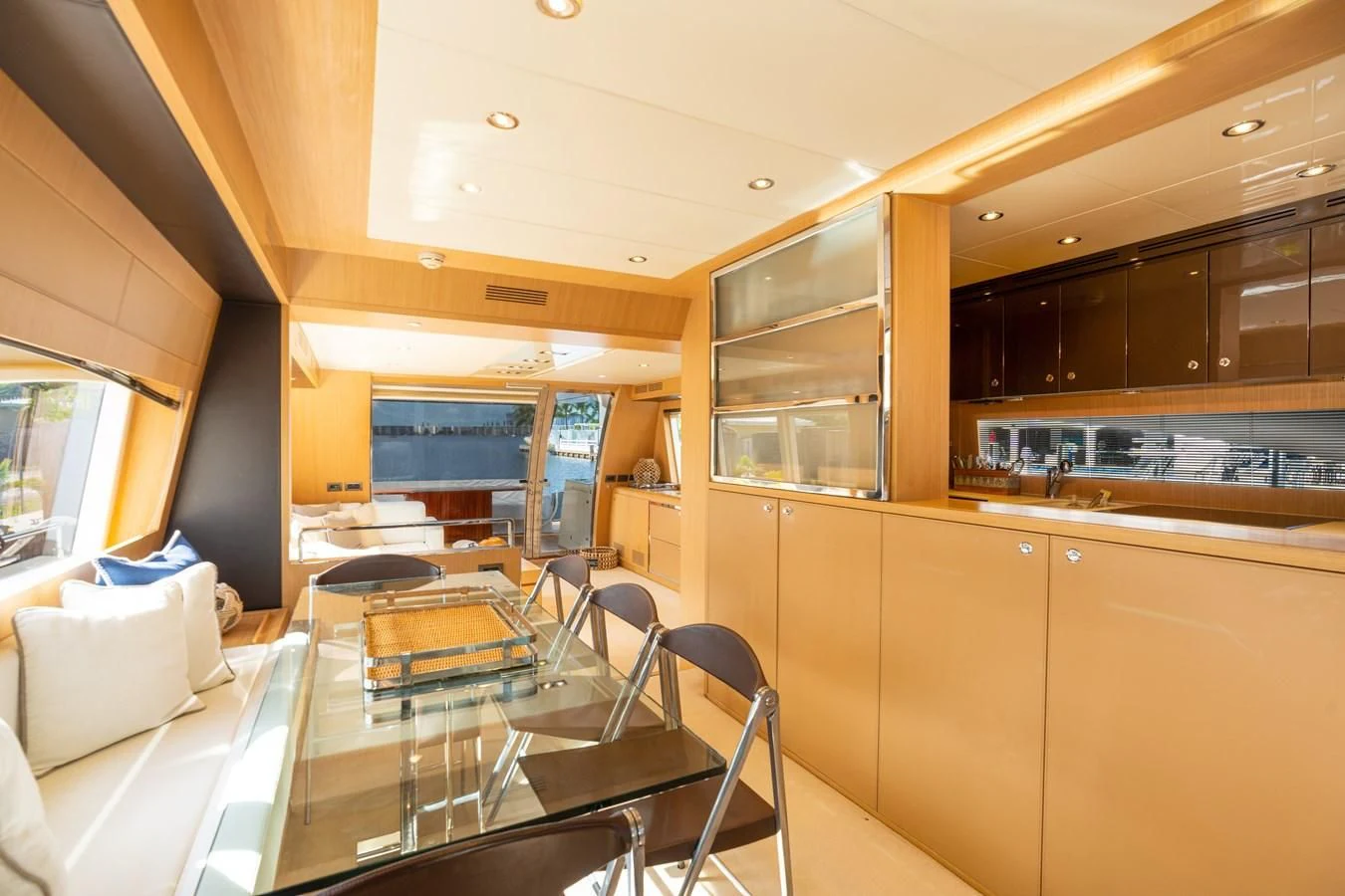 a kitchen with a table and chairs aboard 75' RIVA 2012 Yacht for Sale