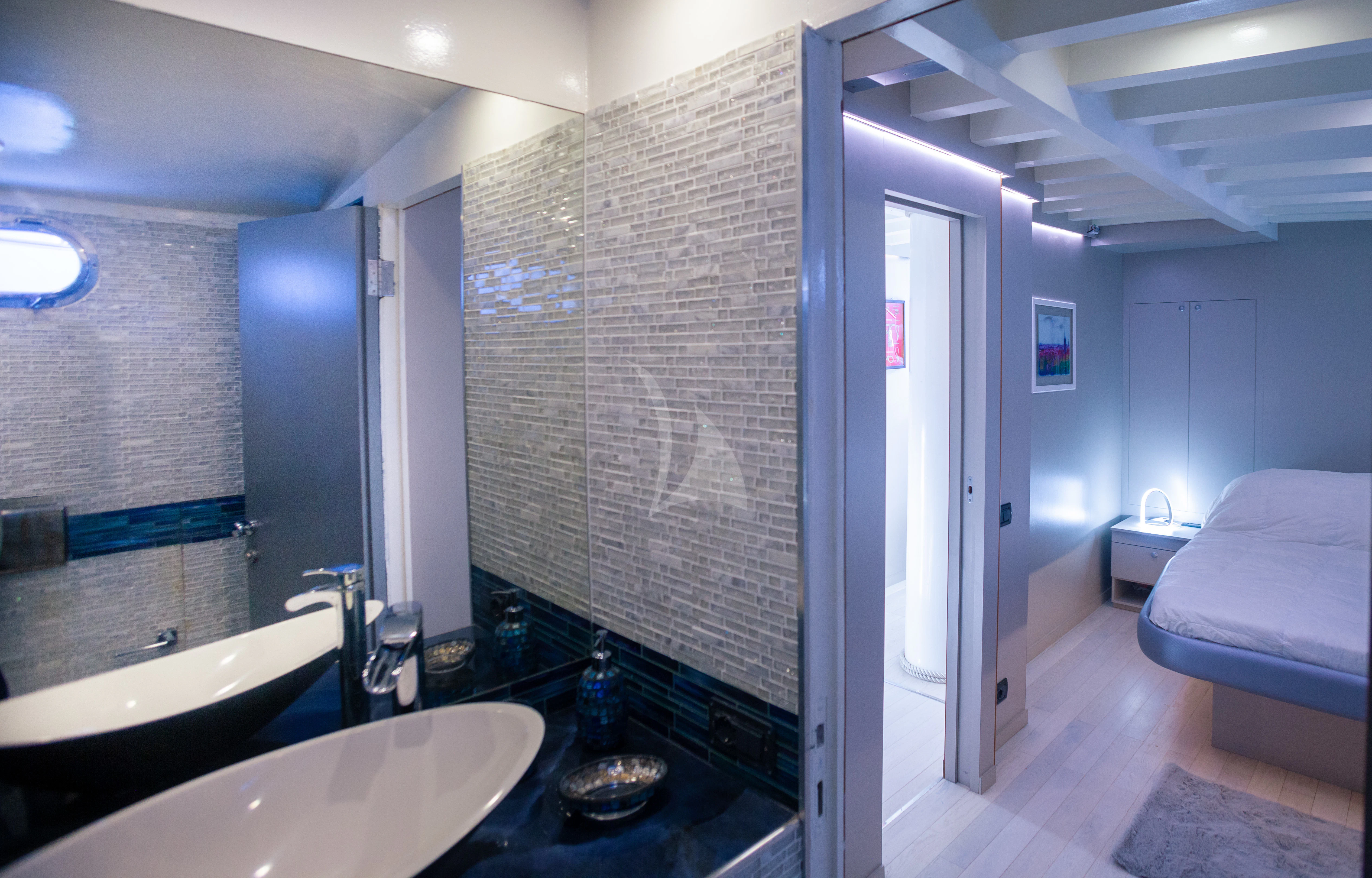 a bathroom with a sink and a bathtub aboard LA MER Yacht for Sale